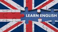Learning English auf dem Hintergrund einer britischen Flagge aus Puzzleteilen